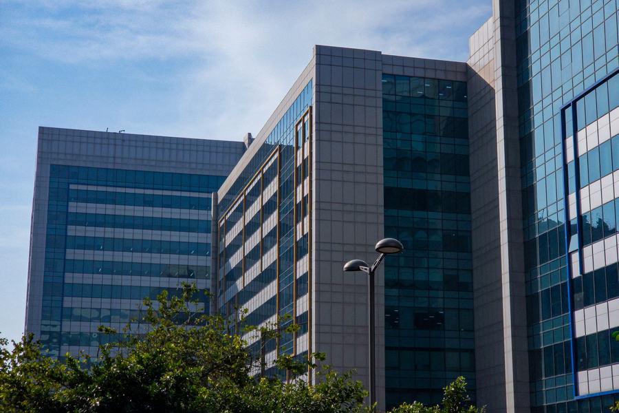 Glass-fronted corporate office towers served under an enterprise procurement contract